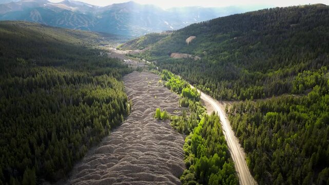 Dredge tailings carved through the forest