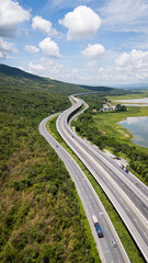 Obraz premium Drone shot The M6 motorway Nakhon Ratchasima Province - Bang Pa-in Lam Ta Khong River and Mountain. Motorway Korat Thailand