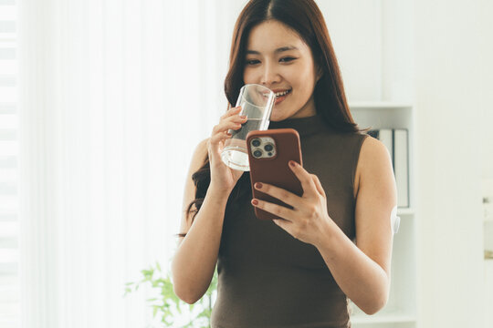 Woman Checking Blood Glucose Level During Telehealth Consultation at Home