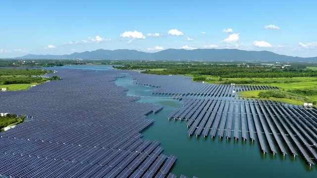 Aerial view of large floating solar power station on lake water