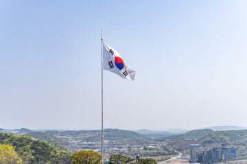 Fototapeta premium The national flag of the Republic of Korea (South Korea), also known as the Taegeukgi. Odusan Unification Observatory, Paju is a city in Gyeonggi Province, South Korea.