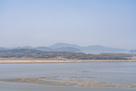 In the distance is Haseong-myeon, Gimpo City area. The confluence of the Han River and the Imjin River (Rimjin). Odusan Unification Observatory, Paju city, Gyeonggi Province. Korean Demilitarized Zone