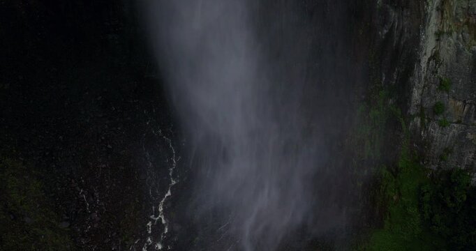 A close-up view of soft, swirling smoke against a dark background, creating a mysterious.