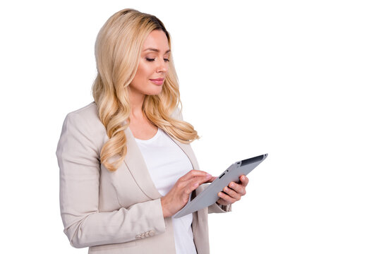 Portrait of her she nice attractive charming focused skilled wavy-haired lady holding in hands using tablet seeking promotion vacancy career isolated over light white gray pastel color background