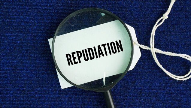 Magnifying glass and paper tag with the word Repudiation is the formal act of rejecting, disowning, or refusing to accept something as true, valid, or binding.