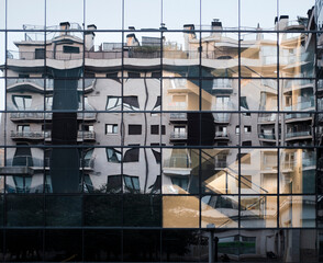 Obraz premium Modern mirrored glass building reflecting urban architecture in Donostia San Sebastian Spain