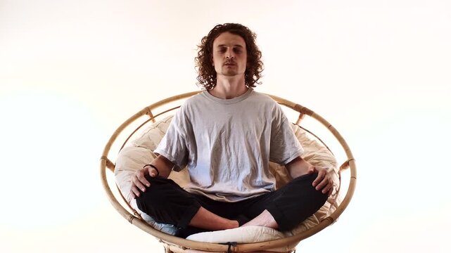 Full Body Man Meditating in Spiritual Mindfulness Pose on Circular Seat