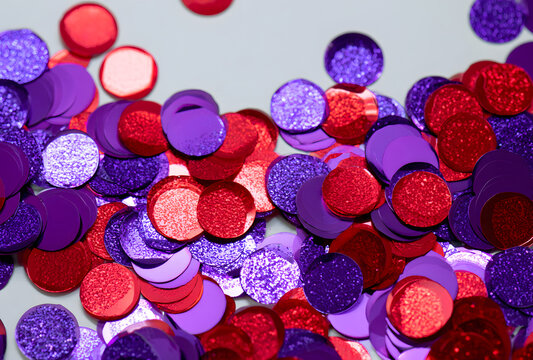 Purple and red glitter scattered sequins and confetti decorations