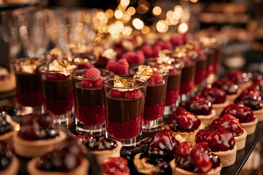 dessert buffet filled with mini parfaits and tarts