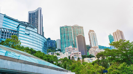 Fototapeta premium Hong Kong skyline with tall buildings and greenery