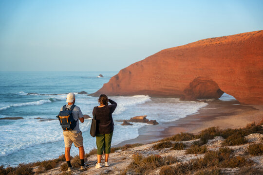 Couple enjoying the view of Legzira Beach at sunset