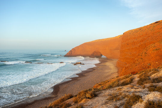 Stunning red rock arches on Legzira Beach at sunset