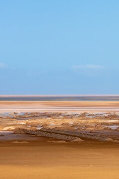 Sebkha Tazgha salt flat desert landscape under blue sky in Morocco