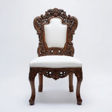Ornate antique wooden chair with intricate carvings showcasing luxury and classic design against a plain white studio backdrop