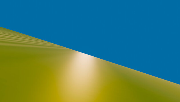 Sand dune with sunlight reflection in clear blue desert sky
