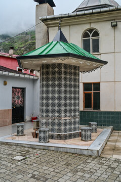 Covered washing fountain with geometric tiles in the courtyard of a village mosque in the mountains near Uzung&ouml;l, Trabzon Province, Black Sea region, T&uuml;rkiye 