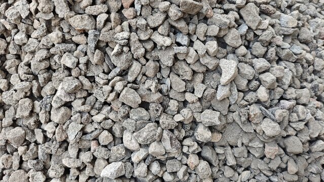 Coarse gray gravel and crushed stone texture background