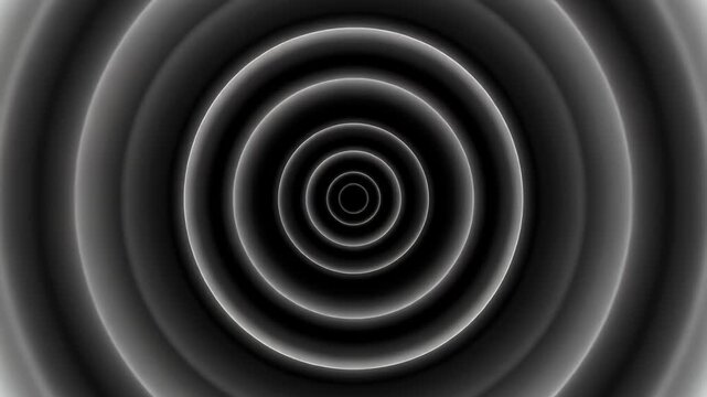 Concentric circles with glowing white edges against a black background.