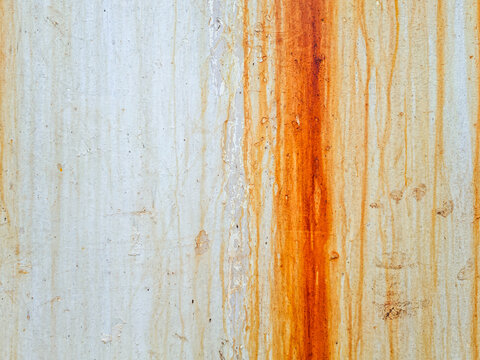 Dirty white wall background with dramatic vertical steel rust streaks and textured time deterioration patterns.