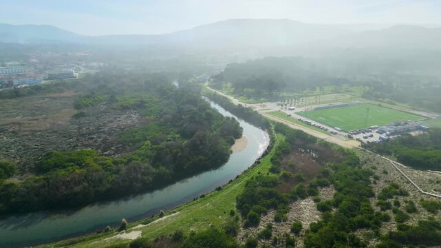 Drone aerial view of the Rio &Acirc;ncora near Vila Praia de &Acirc;ncora, Portugal, showing the football field, sandy beach, river and Atlantic coastline.