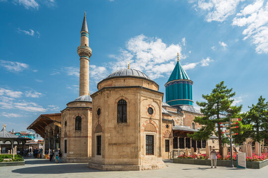 Mevlana Museum with Green Dome and minaret under blue sky in Konya