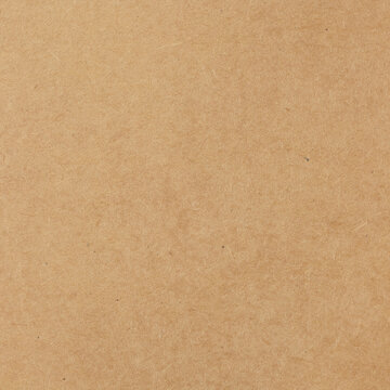 Brown cardboard sheet abstract background, texture of sepia color kraft paper with vintage pattern for design art work.