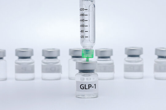 Hopeful medical scene features syringe drawing glp1 injection dose from vial for health care treatment and medication