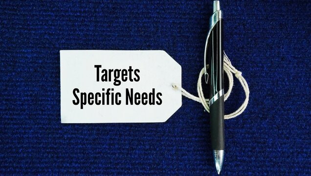 Pen and paper tag with the words Targets specific needs. focusing resources, actions, or solutions directly on a precise, well-defined requirement or problem rather than using a general approach.