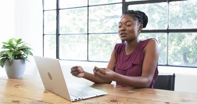 Lifestyle videos indoor of people doing activities at office, woman using laptop working at wooden d