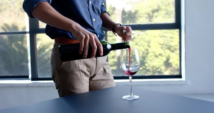 Lifestyle videos indoor of people doing activities at office, holding wine glass, man appreciating d