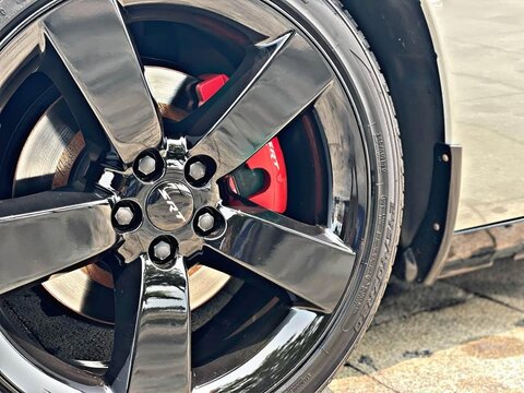 Dodge SRT muscle car wheel and red caliper