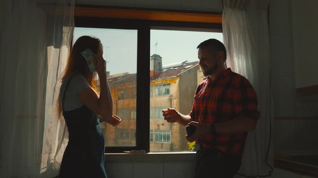 Woman paying a man in cash for his services