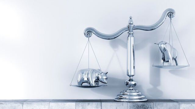 Bull and bear on scales standing on ledge