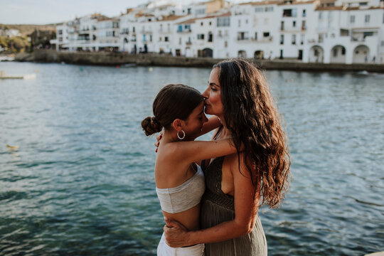 A mother and daughter embrace each other in Cadaques