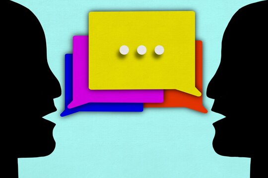 Colorful speech bubbles show communication of silhouettes
