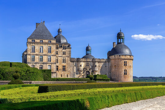 Chateau de Hautefort in France, scenic wide view. Classical architecture style under bright afternoon daylight