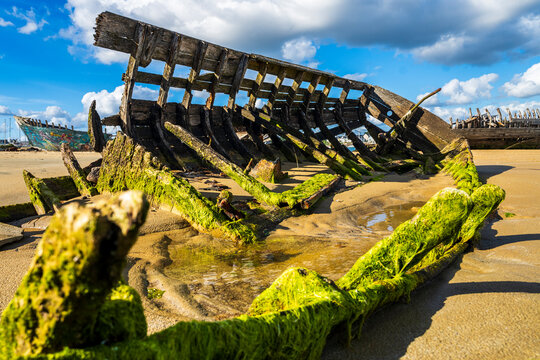 Abandoned wooden shipwreck at Le Magou�r ship cemetery in Brittany