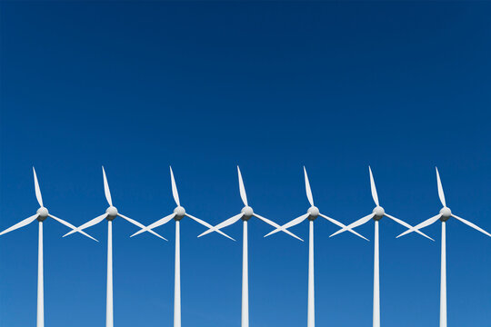 Germany, Bavaria, Wind turbine against blue sky