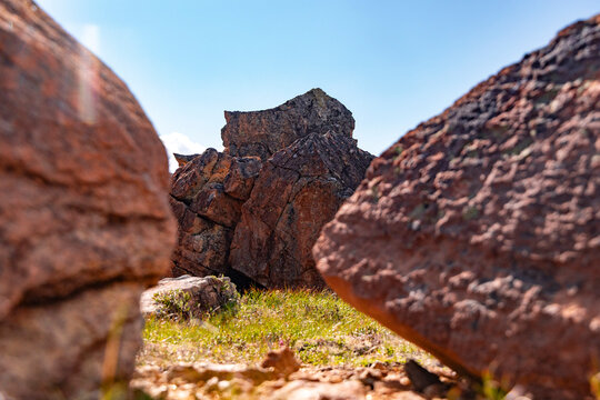 Interesting, orange rock outcrops in a nature reserve. A summer landscape of a protected nature reserve Kallskaret in World Heritage Area in Western Norway.