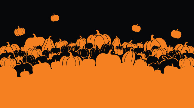A festive halloween background featuring a large collection of carved glowing pumpkins and jack o lanterns arranged against a dark black backdrop