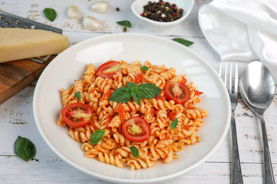 fusilli pasta with tomato sauce and basil	