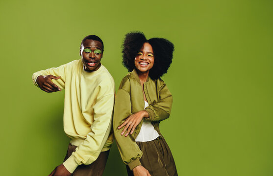 Portrait of friends as a youthful duo dancing together with playful energy