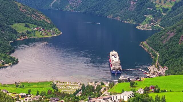 aerial view of large cruise ship anchored at the tourist port of Geiranger in the famous Geirangerfjord, Norway