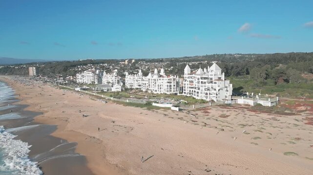 Aerial view of the San Alfonso del Mar resort complex featuring white buildings along the sandy coastline and Pacific Ocean waves in Algarrobo, Valparaiso, Chile.