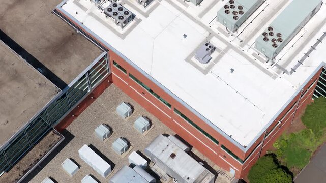 Air-handling, ventilation systems and utility connections installed on a modern data center. Infrastructure that helps regulate airflow, temperature and humidity