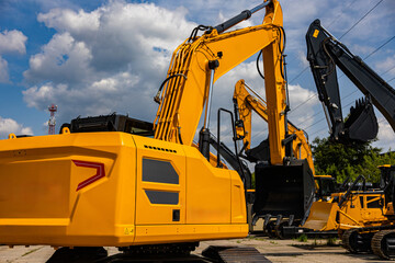 Yellow Crawler Excavator with Hydraulic Boom at Heavy Equipment Yard © NickBalashov