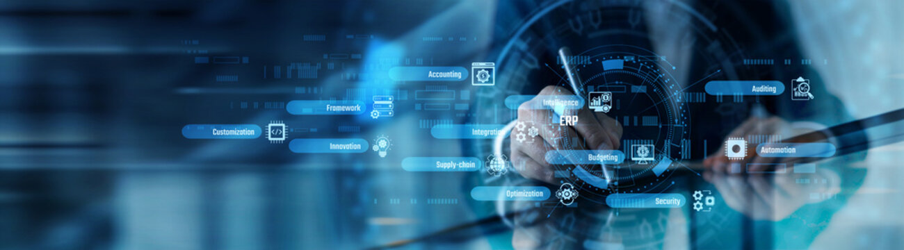 A systems analyst working on tablet and process optimization point of resource planning. ERP implementation and enterprise data centralizing solutions. Business workflow efficiency mapping.