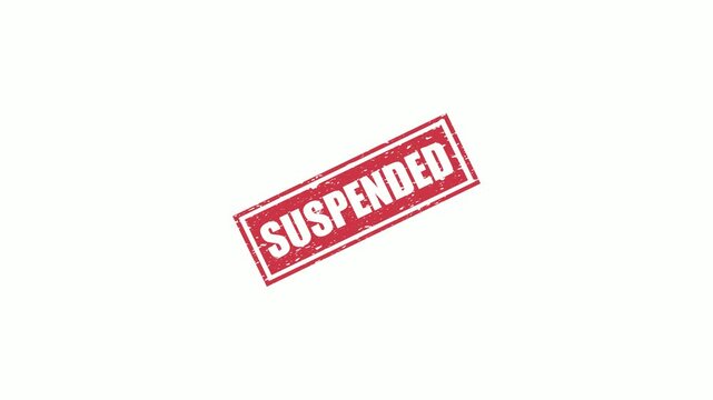 Red grunge rubber stamp with the word suspended isolated on a clean white background surface