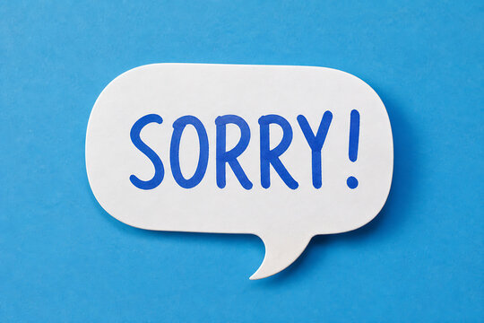 A white speech bubble with the word SORRY! in blue text is displayed against a bright blue background.