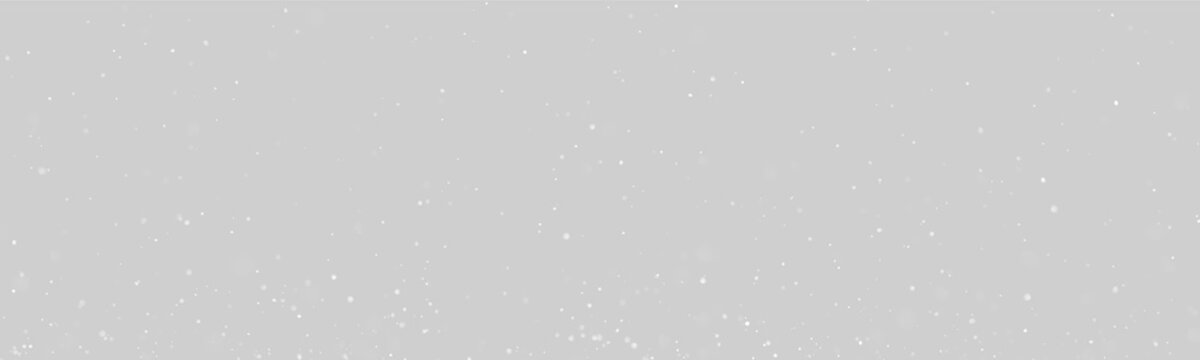 Small white dust particles float suspended on a black background. The particles are scattered with varying sizes and soft edges. This image works well for backgrounds or texture overlays in.